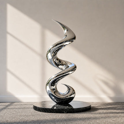 Mirror polished stainless steel spiral motion abstract sculpture with a flowing vertical form