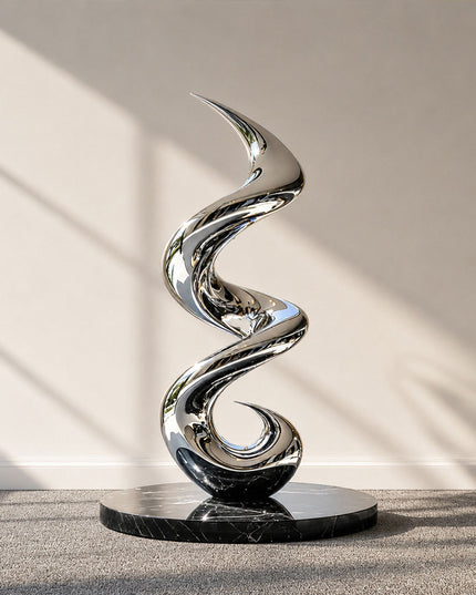 Mirror polished stainless steel spiral motion abstract sculpture with a flowing vertical form