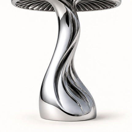 Close-up of the twisting openwork stem and curved base of a mirror polished stainless steel mushroom sculpture