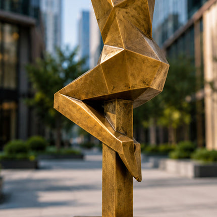 Close-up detail of bronze-tone painted stainless steel sculpture surface and geometric form