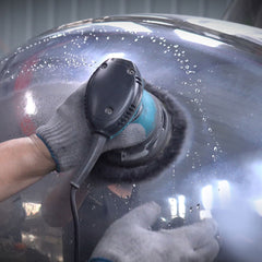 Final polishing stage creating mirror-like surface on stainless steel sculpture