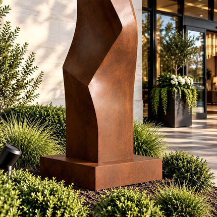 Close-up of the weathered steel surface and lower folded form of the sculpture