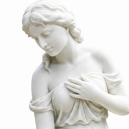 Close-up of the carved face, wavy hair, hand, and upper drapery of a white marble female statue