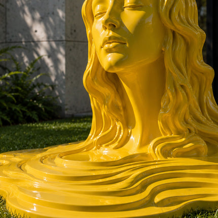Detail view showing the high-gloss painted finish and flowing contours of stainless steel artwork